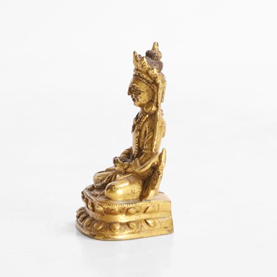 Lot 145 - A Tibetan gilt-bronze miniature bodhisattva