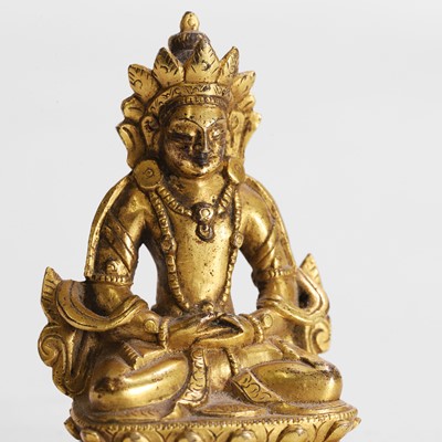 Lot 145 - A Tibetan gilt-bronze miniature bodhisattva