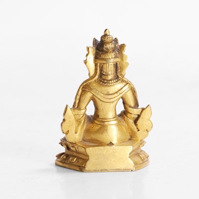 Lot 145 - A Tibetan gilt-bronze miniature bodhisattva