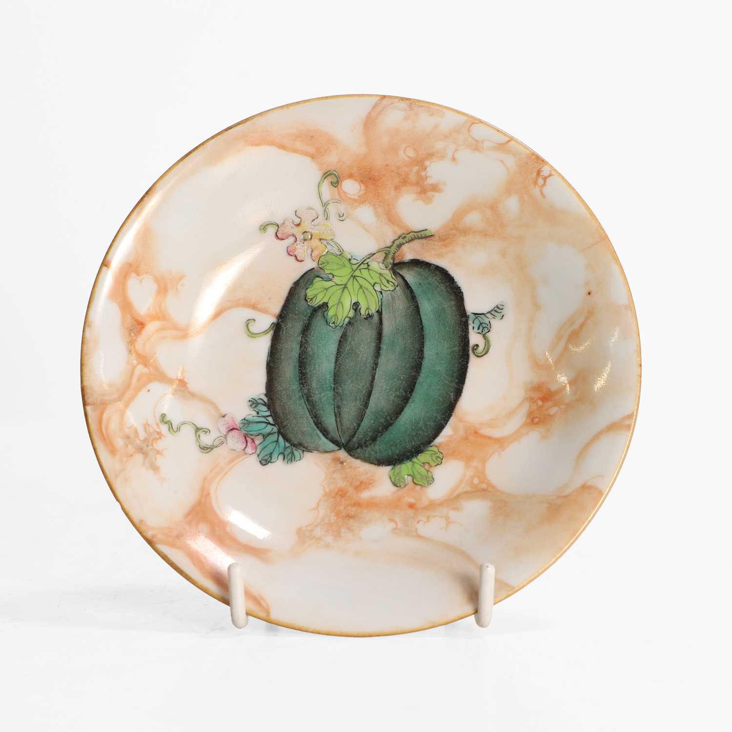 Lot 131 - A Chinese faux-marble enamelled porcelain saucer