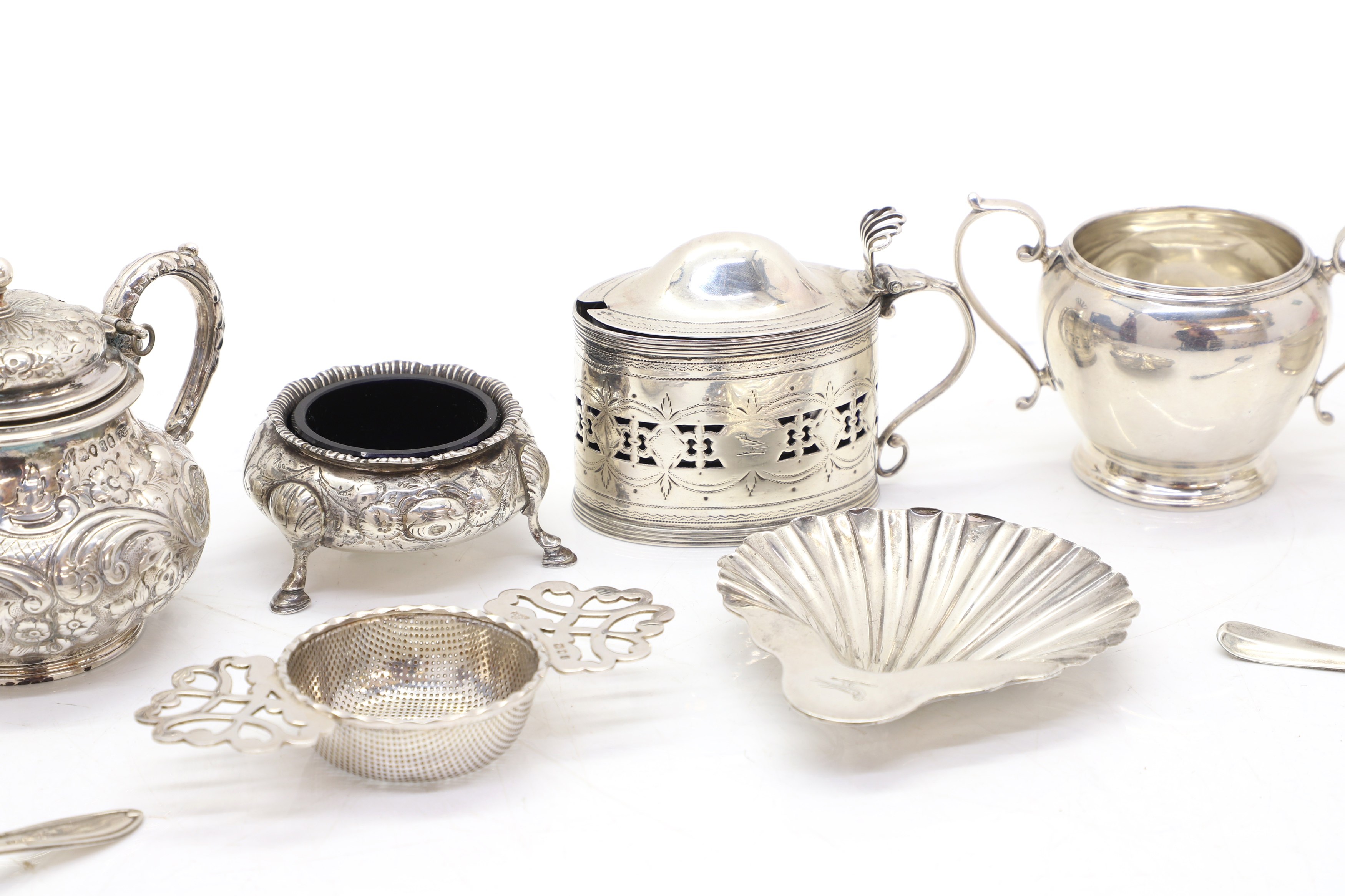 Lot 20 - A collection of silver cruet items,