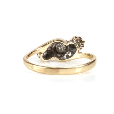 Lot 51 - A 9ct gold diamond three stone crossover ring