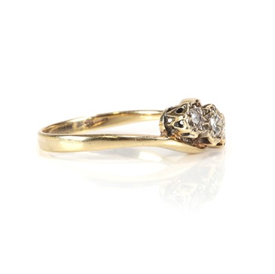 Lot 51 - A 9ct gold diamond three stone crossover ring