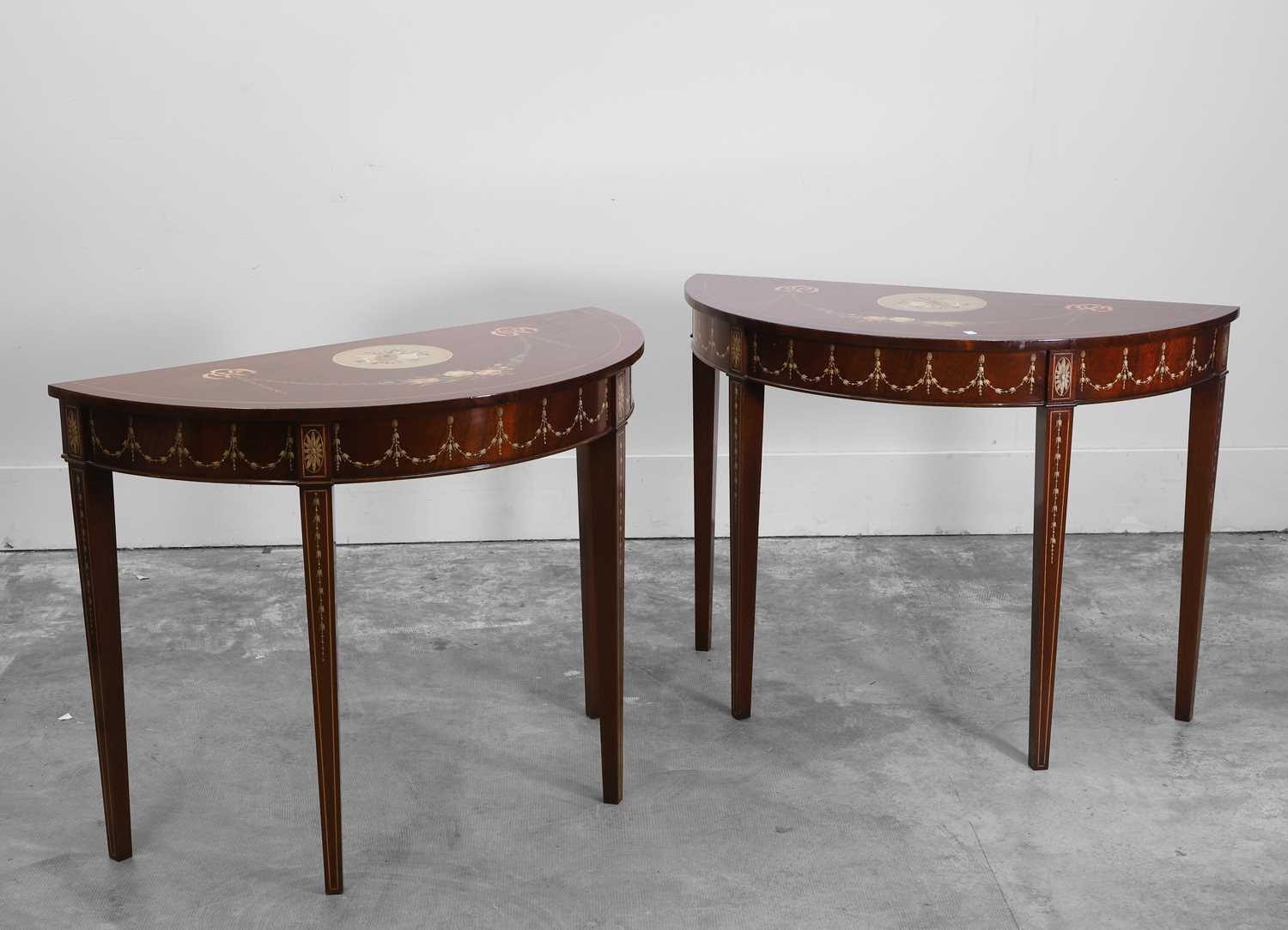 Lot 505 - A pair of mahogany painted console tables
