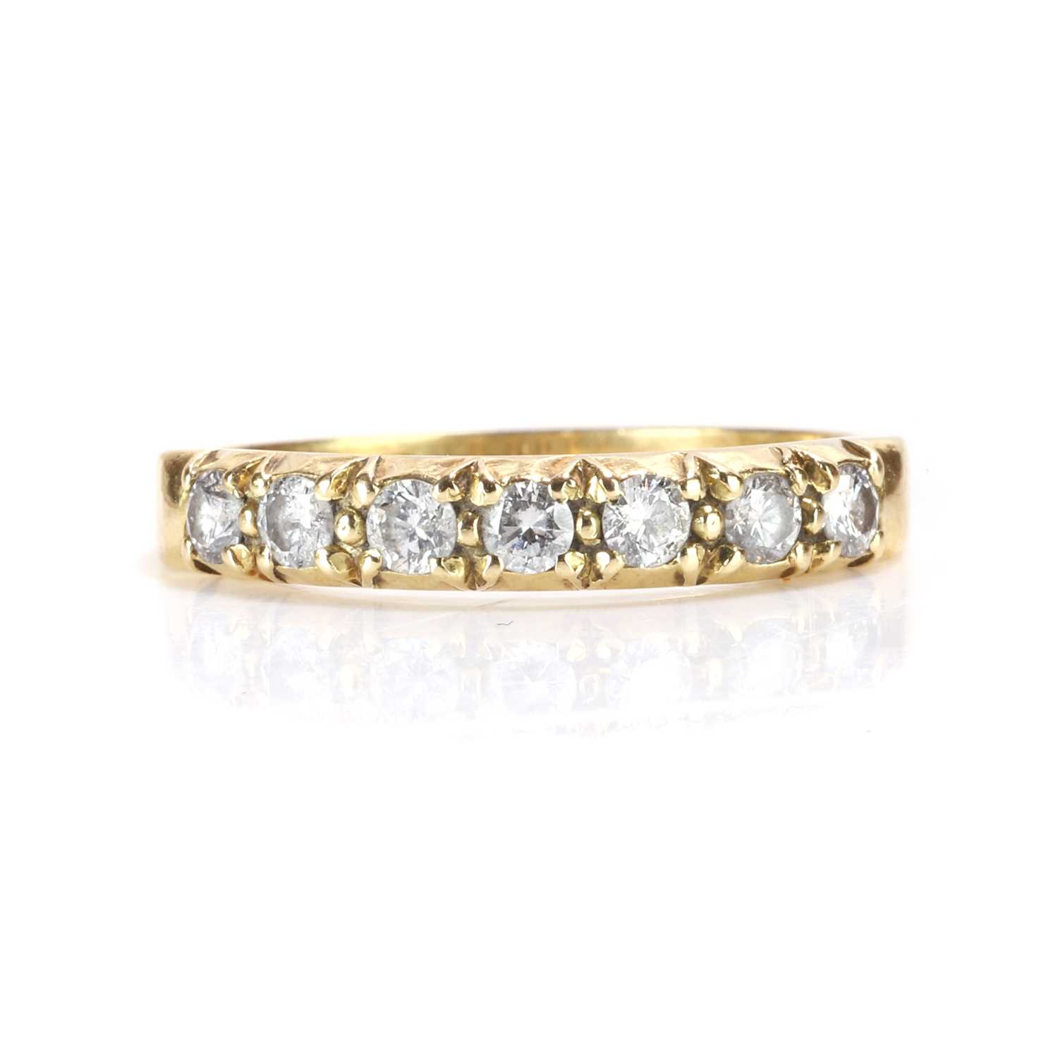 Lot 78 - An 18ct gold diamond half eternity ring