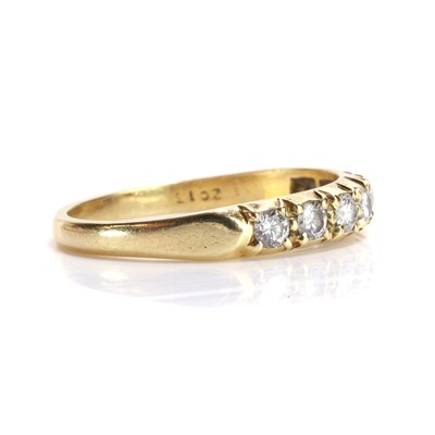 Lot 78 - An 18ct gold diamond half eternity ring