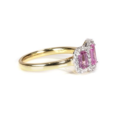 Lot 101 - An 18ct gold pink sapphire and diamond triple cluster ring