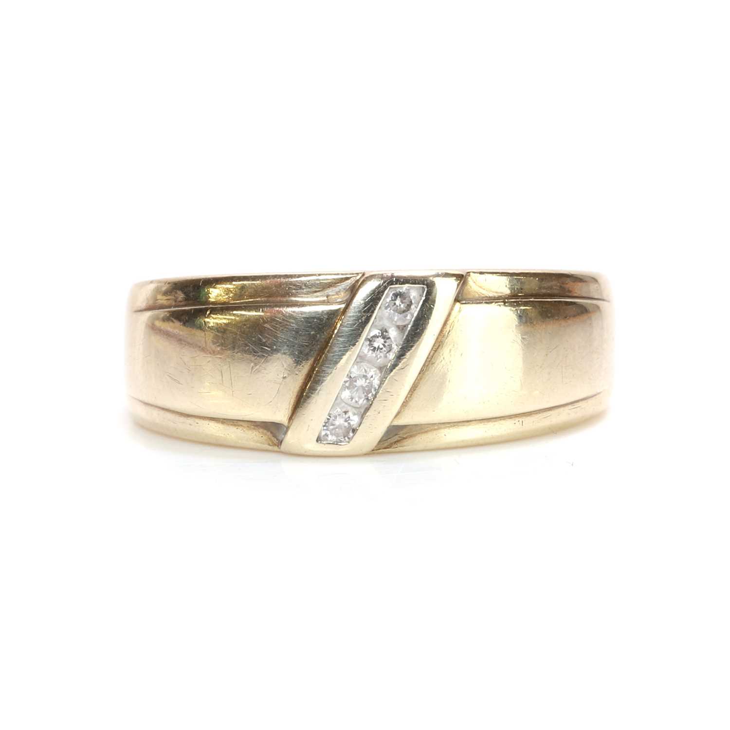 Lot 41 - A 9ct gold diamond set band ring