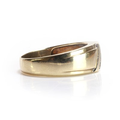 Lot 41 - A 9ct gold diamond set band ring