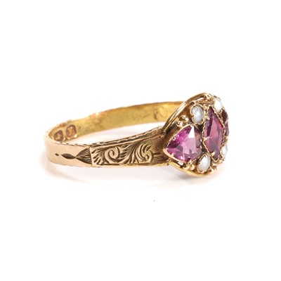 Lot 3 - A Victorian 15ct gold garnet and split pearl three stone ring