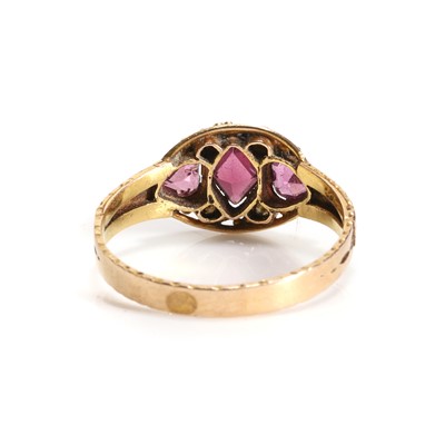 Lot 3 - A Victorian 15ct gold garnet and split pearl three stone ring