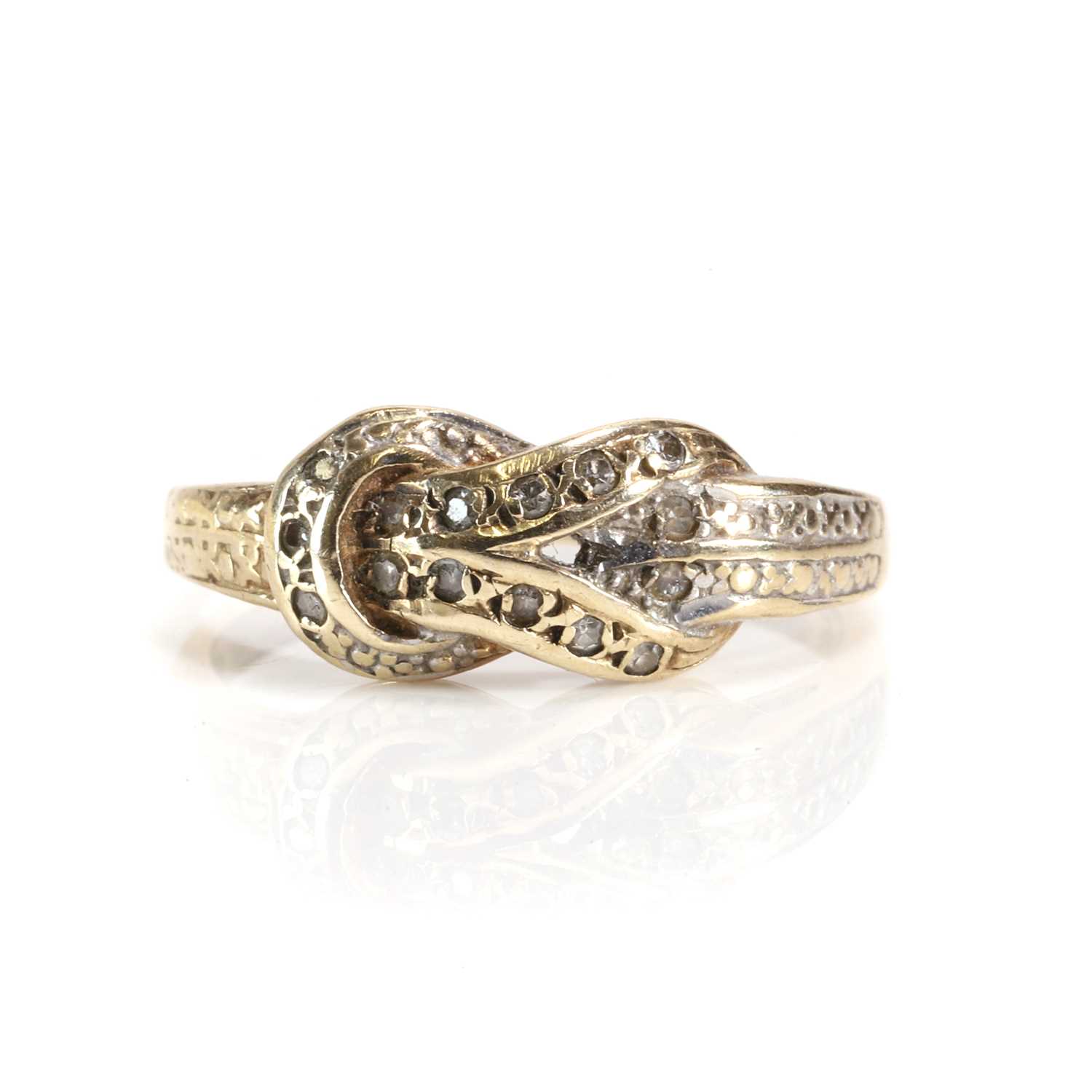 Lot 40 - A 9ct gold diamond set knot ring