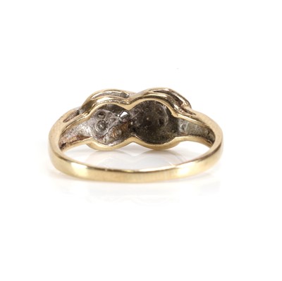 Lot 40 - A 9ct gold diamond set knot ring
