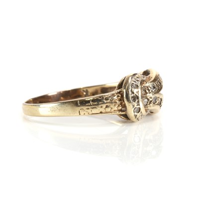 Lot 40 - A 9ct gold diamond set knot ring