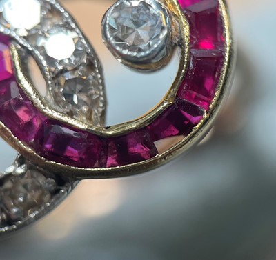 Lot 30 - A ruby and diamond interlocking circle ring