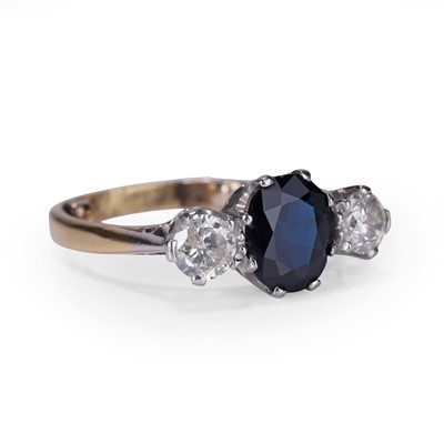 Lot 54 - A sapphire and diamond three stone ring