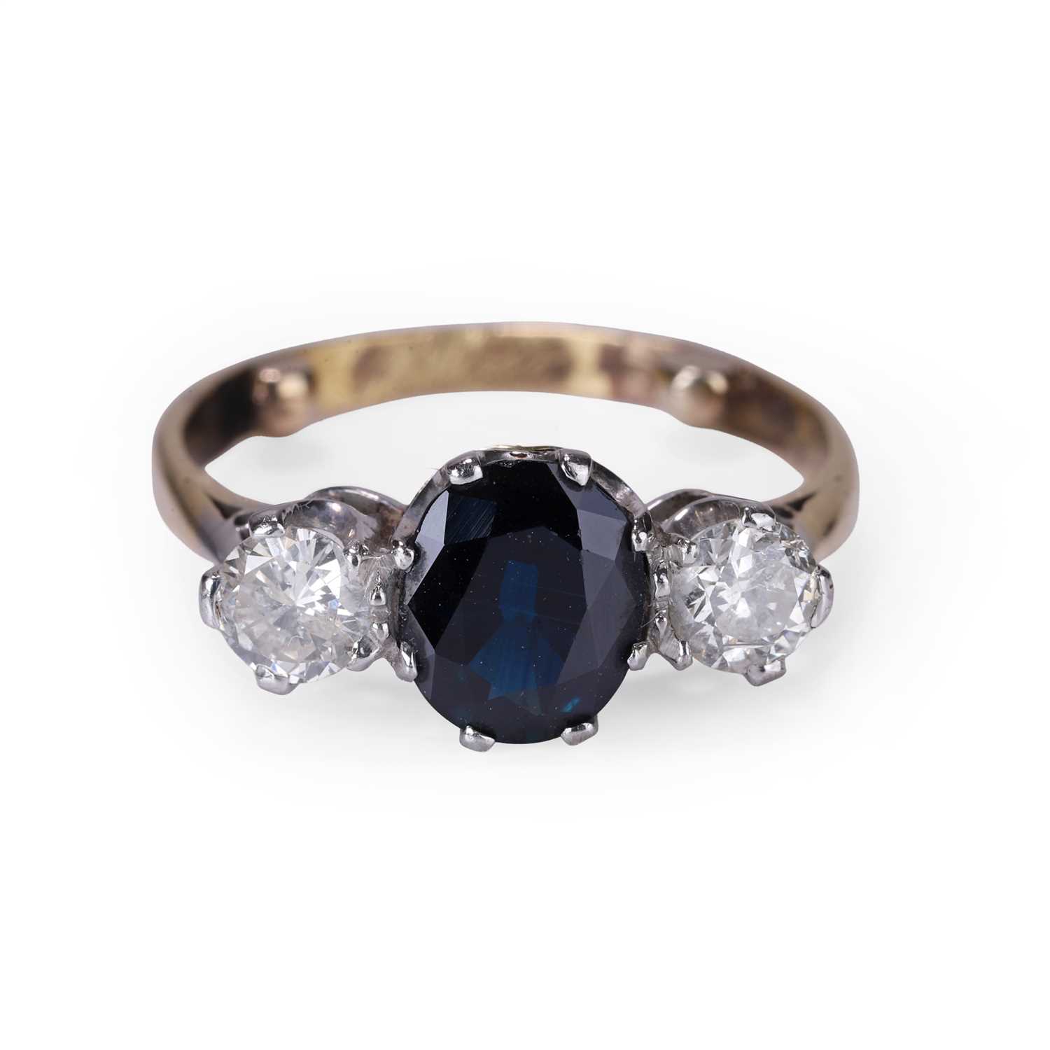 Lot 54 - A sapphire and diamond three stone ring