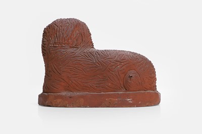 Lot 93 - A Staffordshire-style terracotta figure of a spaniel