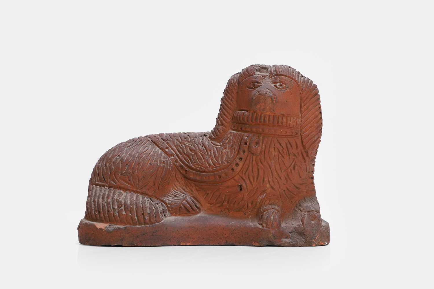 Lot 93 - A Staffordshire-style terracotta figure of a spaniel