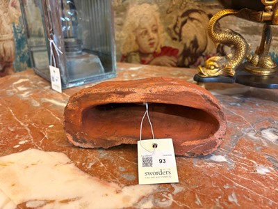 Lot 93 - A Staffordshire-style terracotta figure of a spaniel