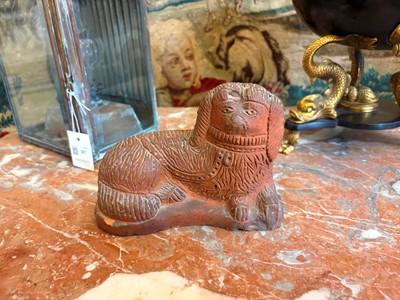 Lot 93 - A Staffordshire-style terracotta figure of a spaniel