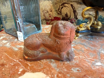 Lot 93 - A Staffordshire-style terracotta figure of a spaniel