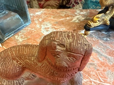 Lot 93 - A Staffordshire-style terracotta figure of a spaniel