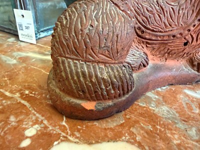Lot 93 - A Staffordshire-style terracotta figure of a spaniel