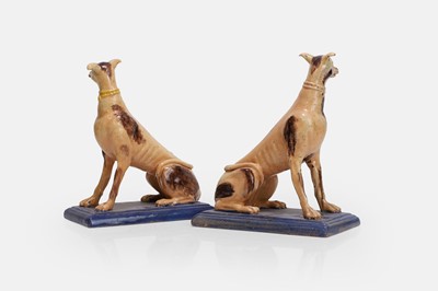 Lot A pair of faience greyhound figures