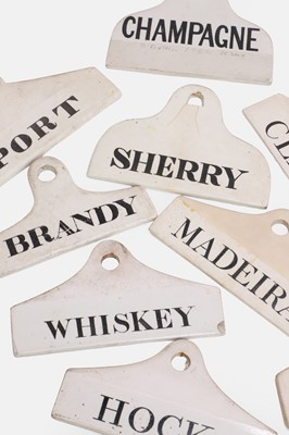 Lot 115 - A collection of nine porcelain wine bin labels