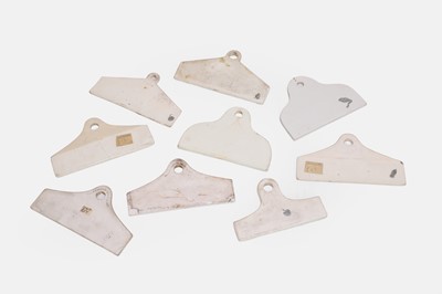 Lot 115 - A collection of nine porcelain wine bin labels