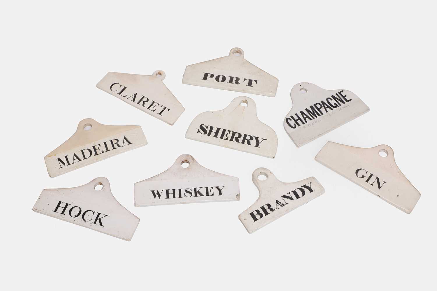 Lot 115 - A collection of nine porcelain wine bin labels