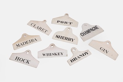 Lot 115 - A collection of nine porcelain wine bin labels