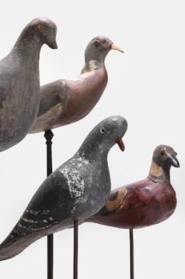 Lot 119 - A flight of four wooden decoy pigeons