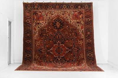 Lot 480 - A Persian Heriz wool carpet