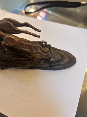 Lot 12 - A silver and wood model of leaping impalas