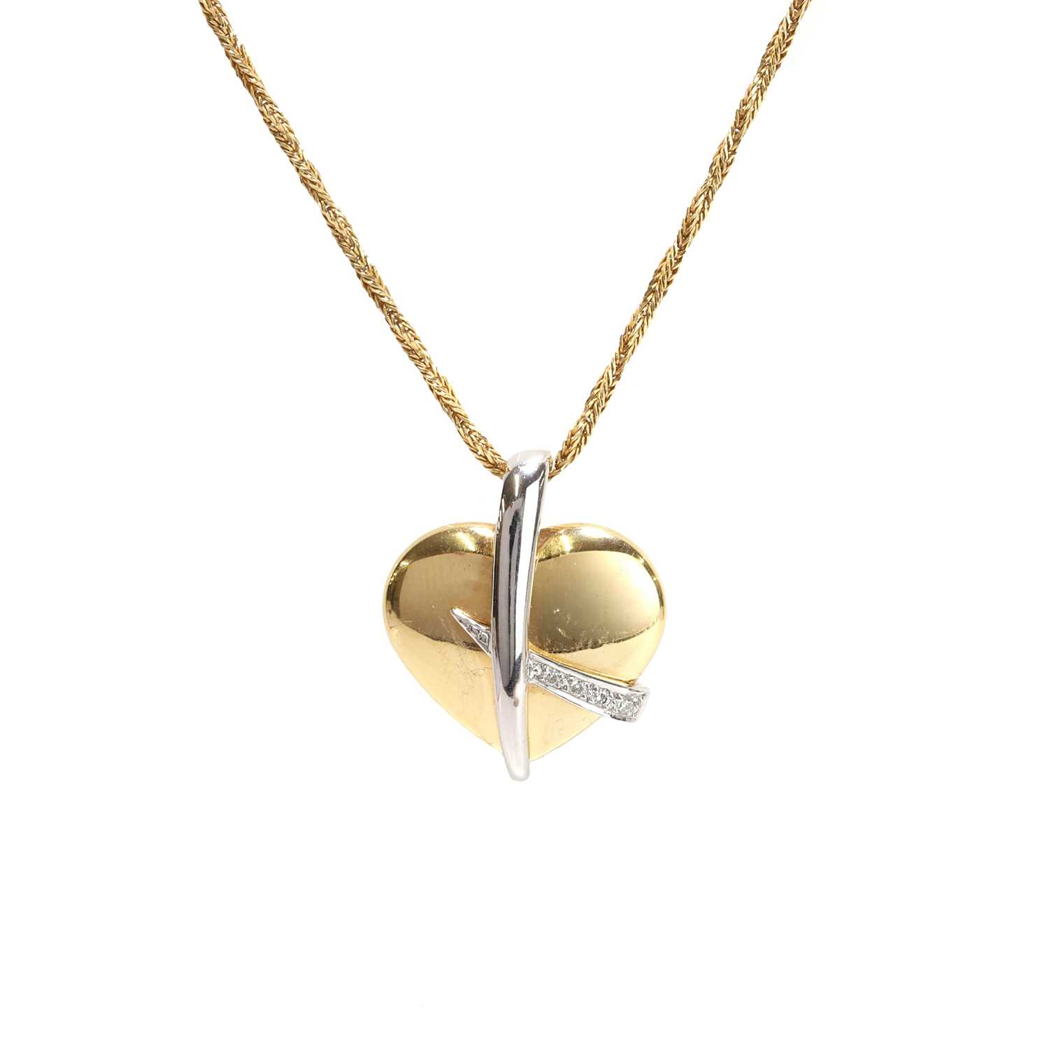 Lot 37 - An 18ct gold two colour gold diamond set heart pendant