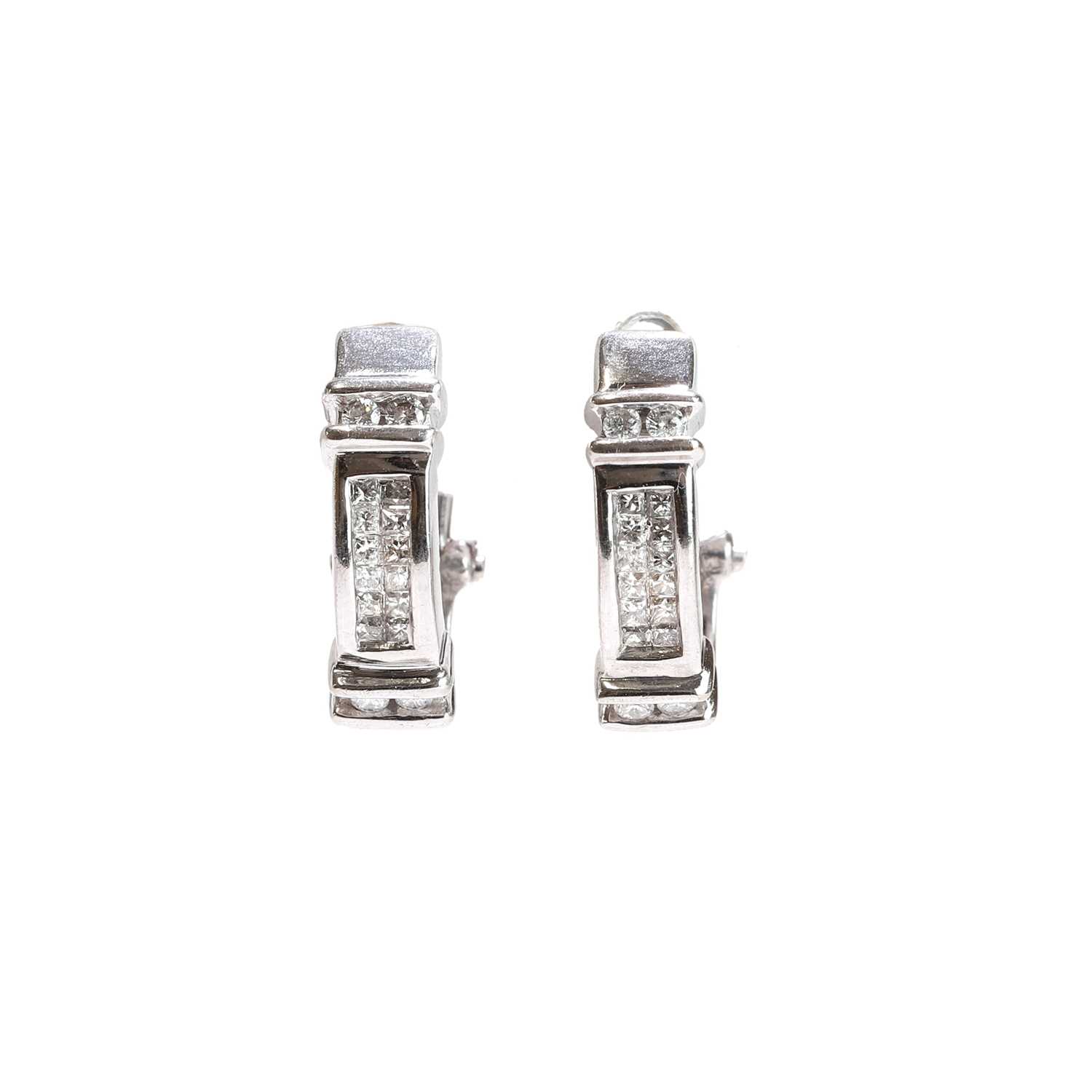 Lot 61 - A pair of diamond cuff earrings