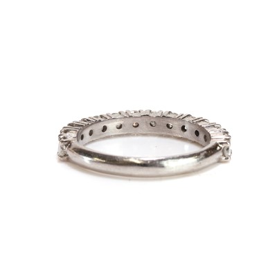 Lot 52 - A platinum and diamond three quarter eternity ring