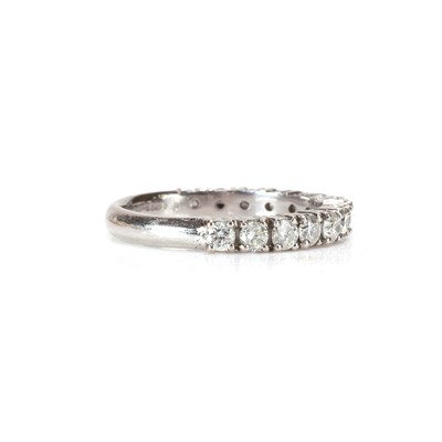Lot 52 - A platinum and diamond three quarter eternity ring