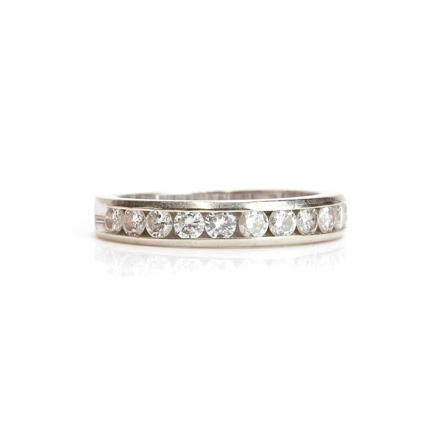 Lot 49 - A diamond half eternity ring
