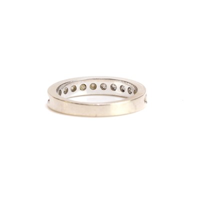 Lot 49 - A diamond half eternity ring