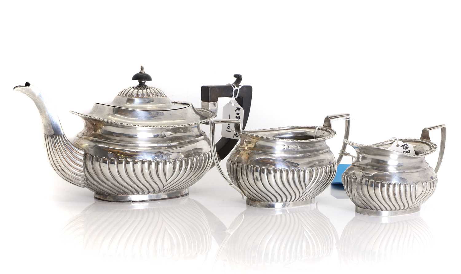 Lot 22 - A three piece silver tea service