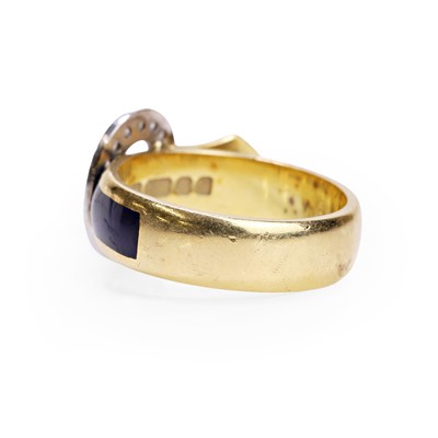 Lot 56 - An 18ct diamond and enamel buckle ring