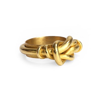 Lot 59 - A high carat gold knot design ring