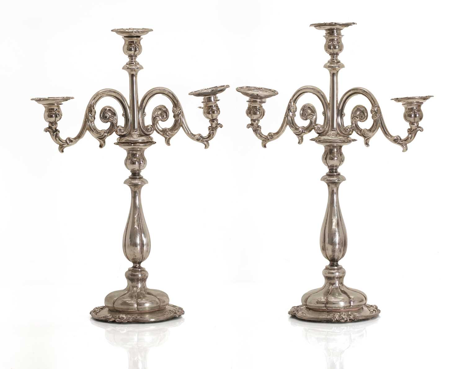 Lot 7 - A pair of Dutch .833 standard silver three-light candelabra