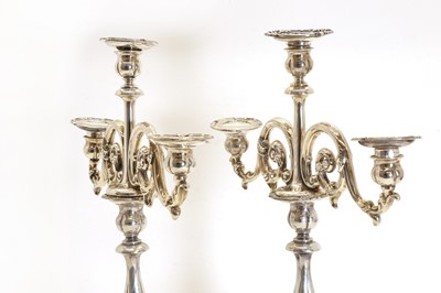 Lot 7 - A pair of Dutch .833 standard silver three-light candelabra