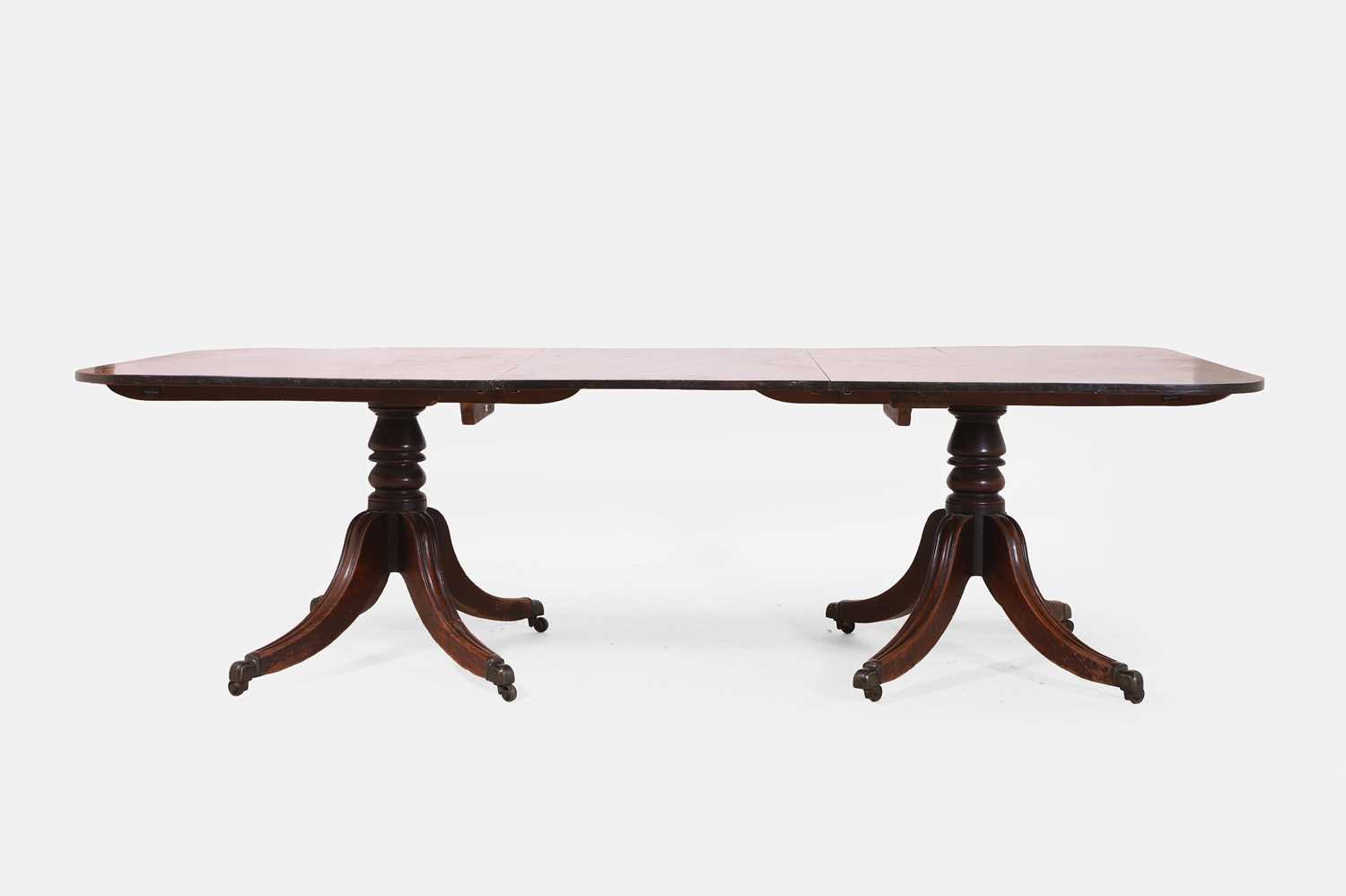 Lot 566 - A Regency mahogany twin pedestal dining table