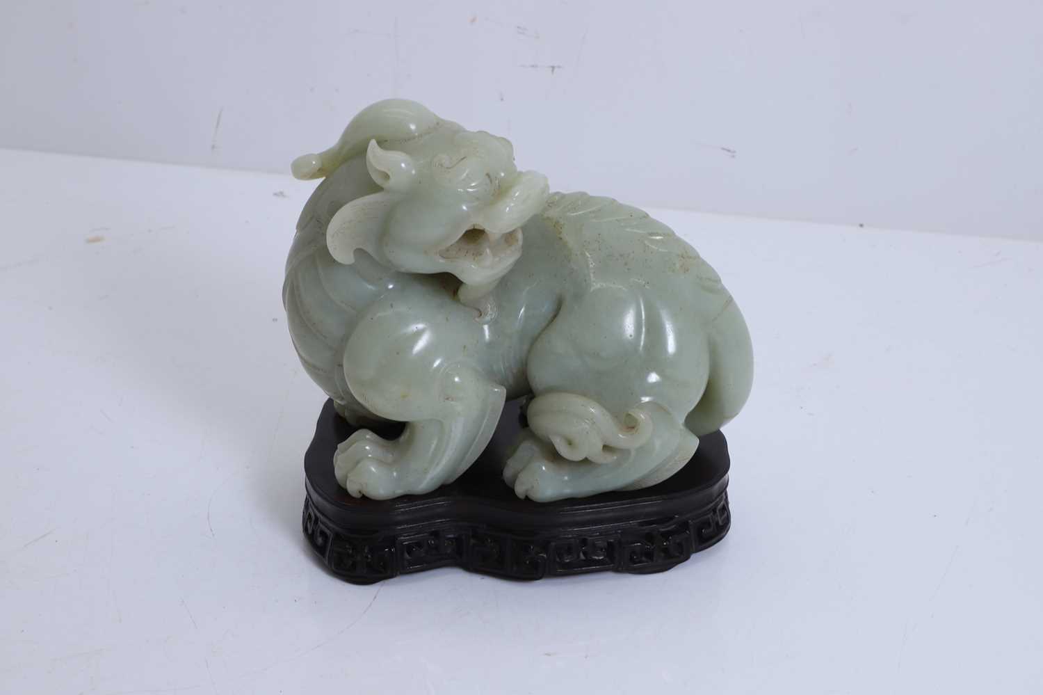Lot 60 - A jade carving of a mythical beast