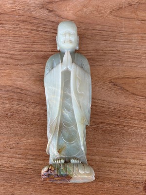 Lot 59 - A Chinese carved jade figure of a Luohan